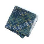 Blue pocket square with white and green abstract pattern