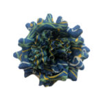Blue lapel flower with white and green abstract pattern