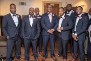 Black Groomsmen and groom in suits and ties