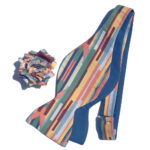 reversible blue and striped jumbo bow tie with matching flower pin in bright colors